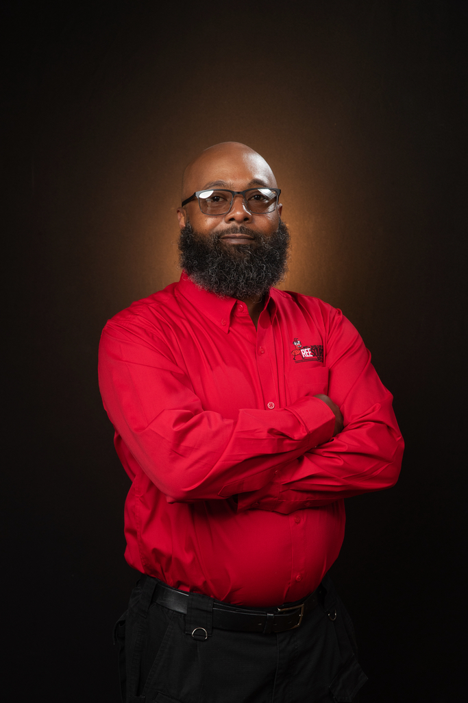 A professional team member from ReeSource Pest posing with arms crossed.